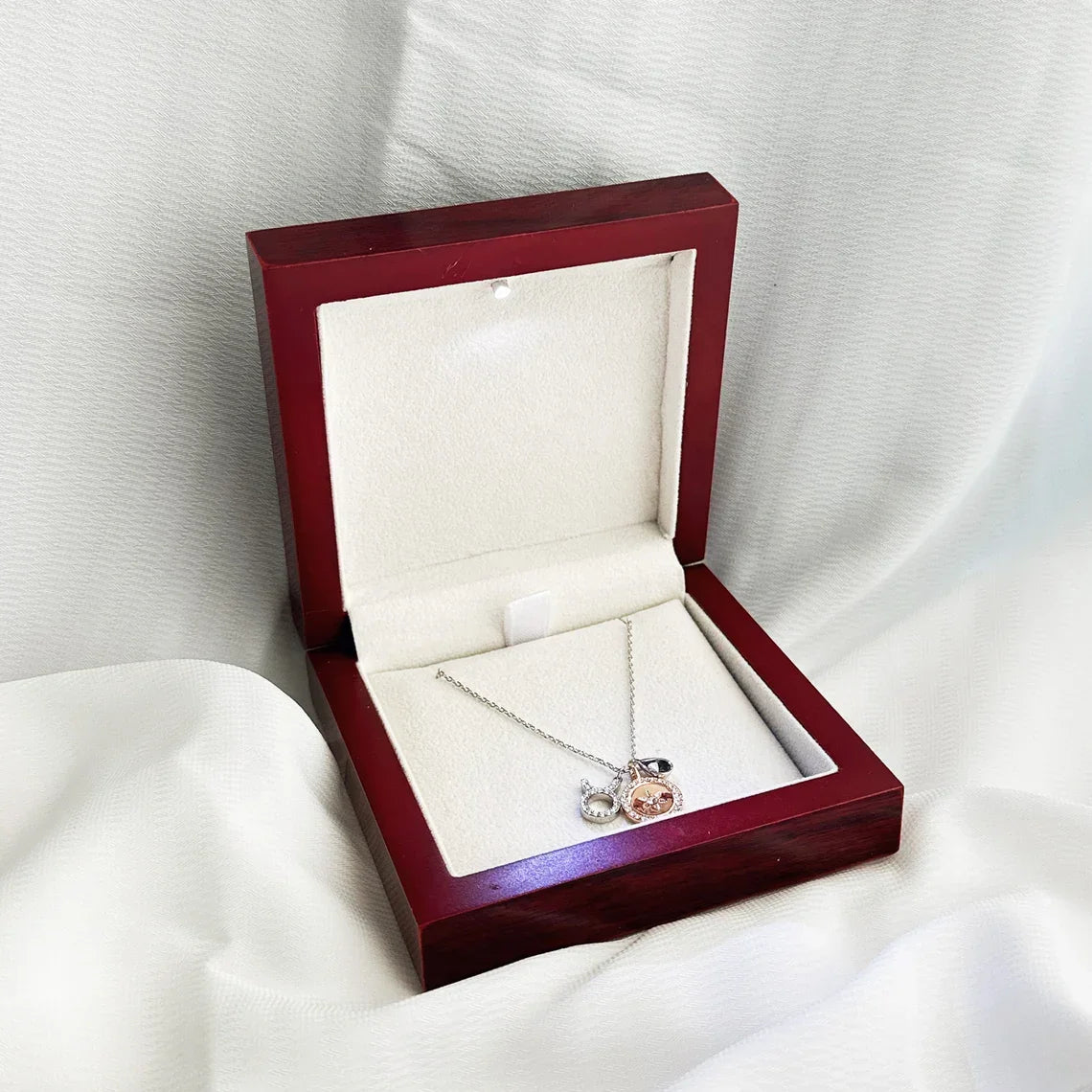 Glossy mahogany red jewelry box with built-in LED light for proposal rings