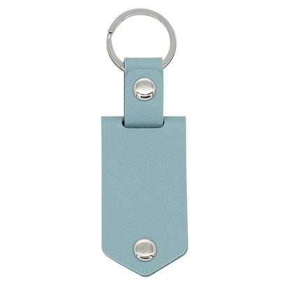 Custom photo keychain in light blue leather with engraved “Drive safe” and picture insert