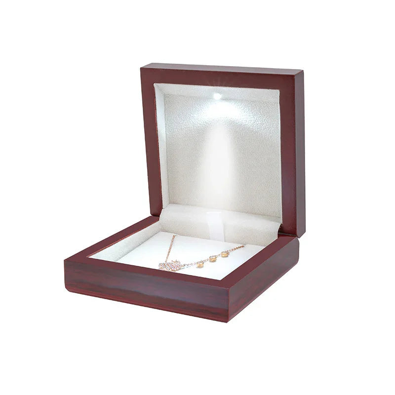 High-gloss red wooden ring box, LED spotlight for diamond brilliance