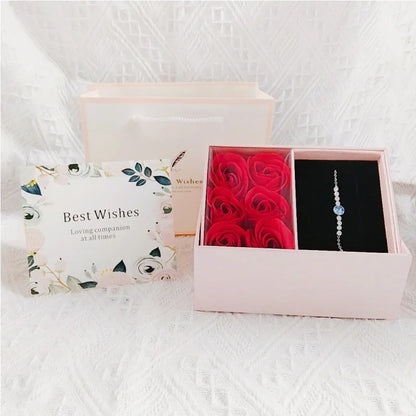 Pink preserved rose jewelry box with “Best Wishes” lid and ring space on the right