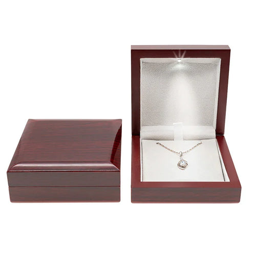 Red wood ring box with LED spotlight that illuminates jewelry when opened